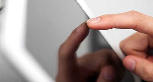 Tapping Screen With Finger To Buy Travel Insurance